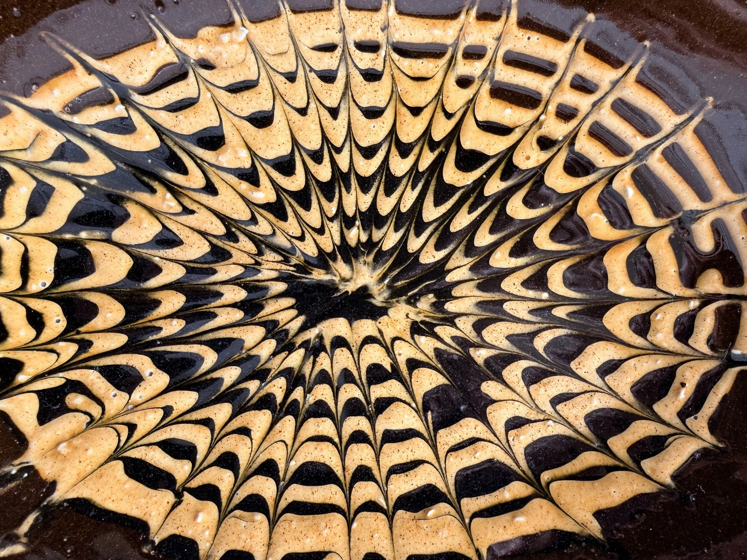 Durable stoneware serving platter with traditional English slipware heritage design.