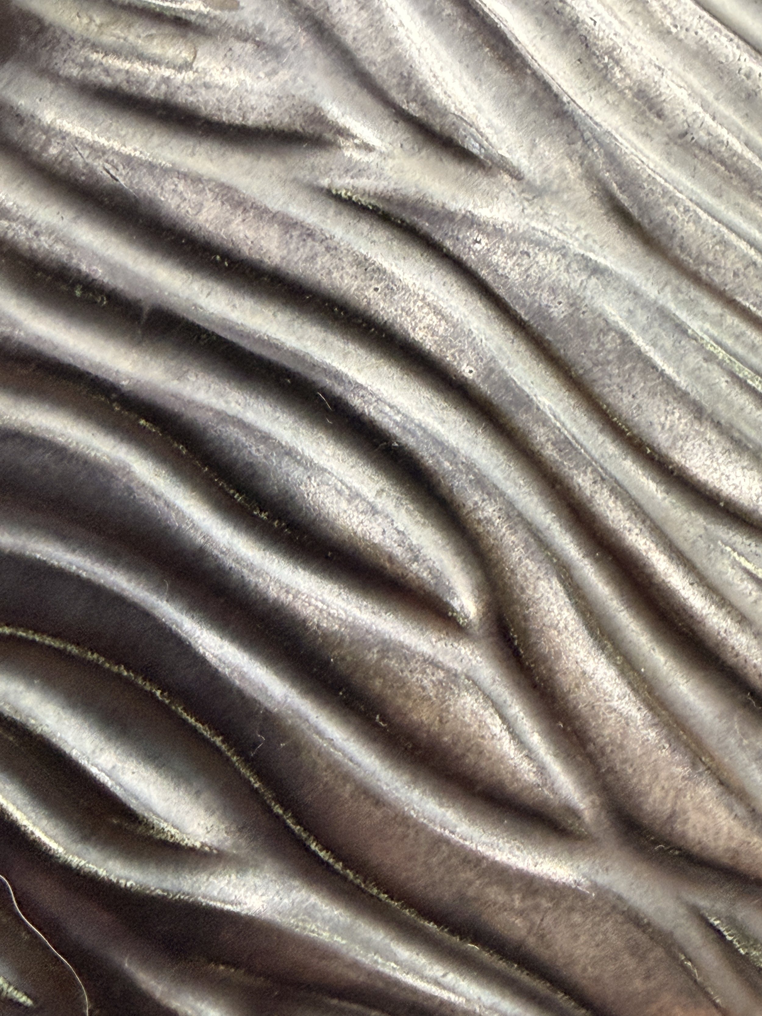 Close-up of the satin-matte black glaze on the vintage MCM mantle centerpiece.