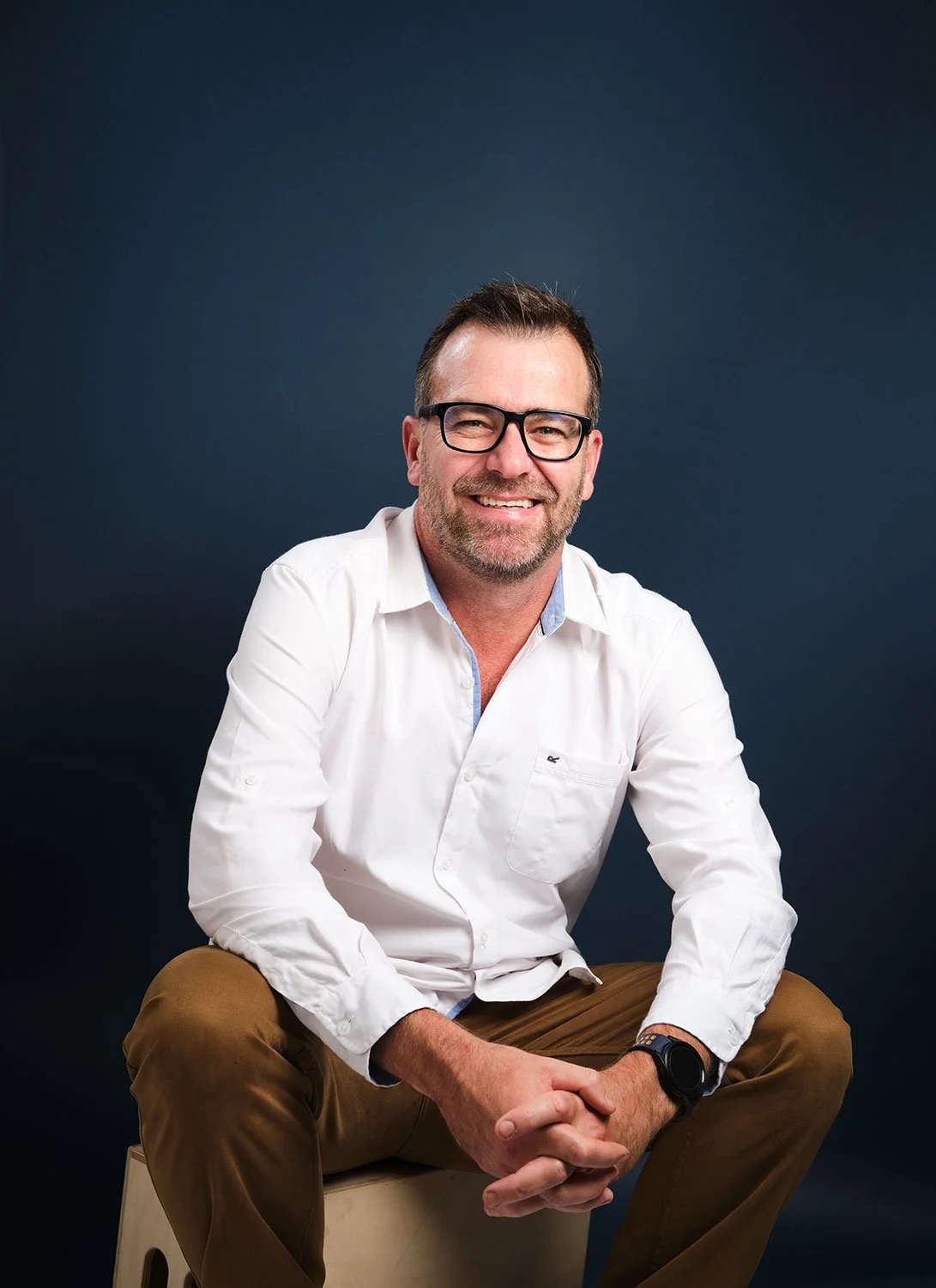 relaxed smiling business man sitting