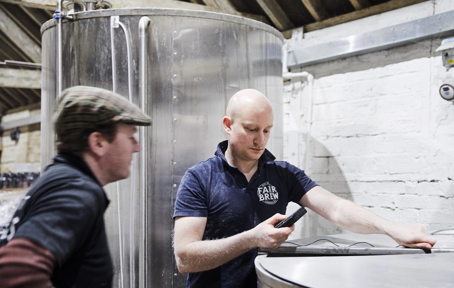 Breweries workers checking temperature of water