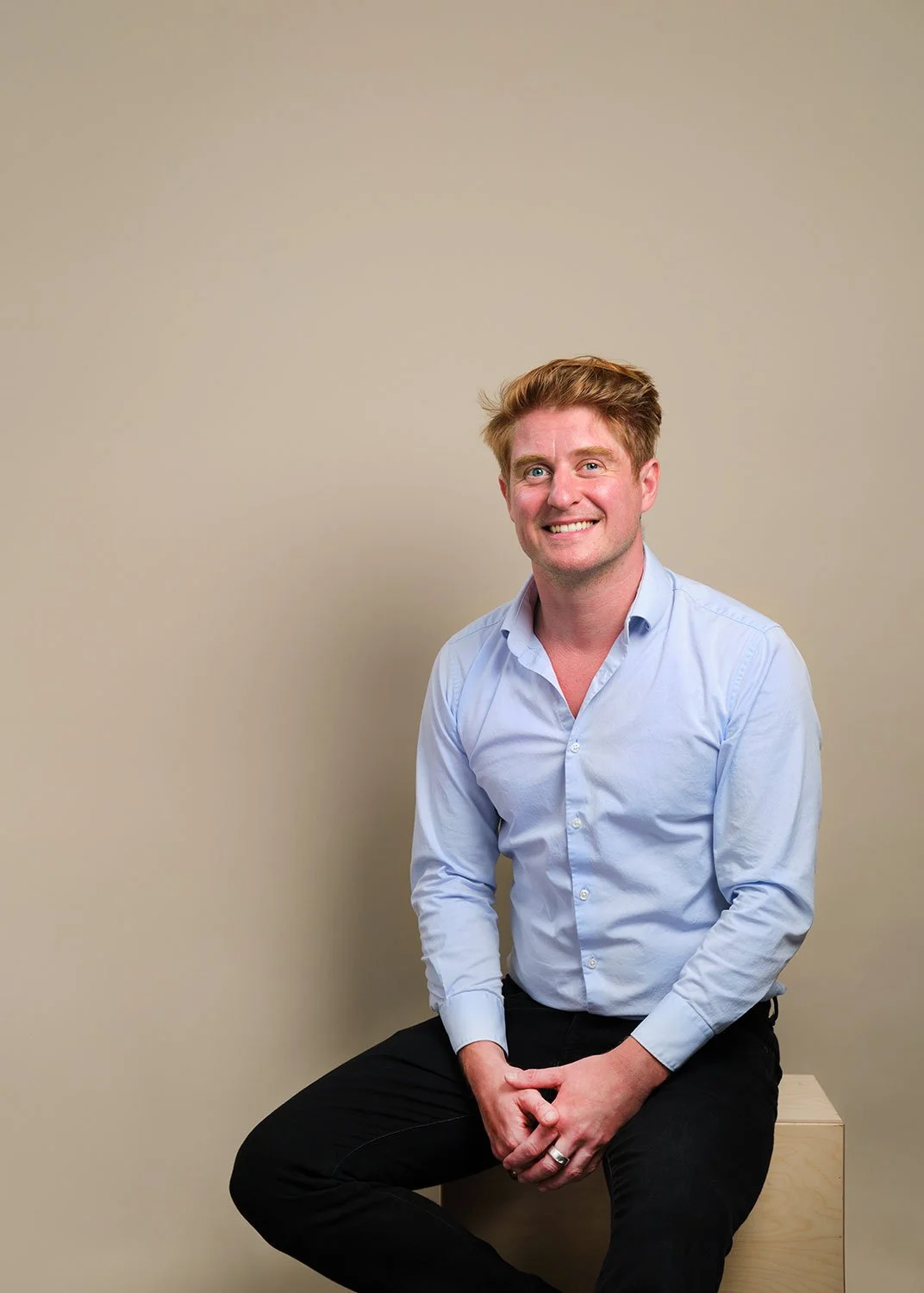 casually dressed business man sitting