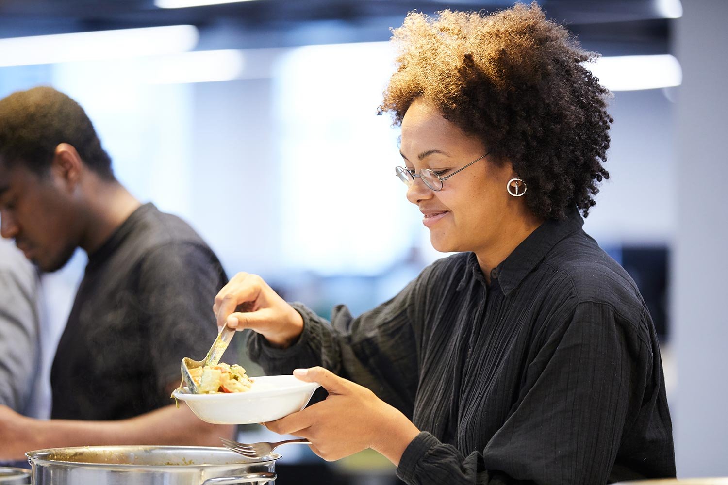 Employee plating up in company restaurant