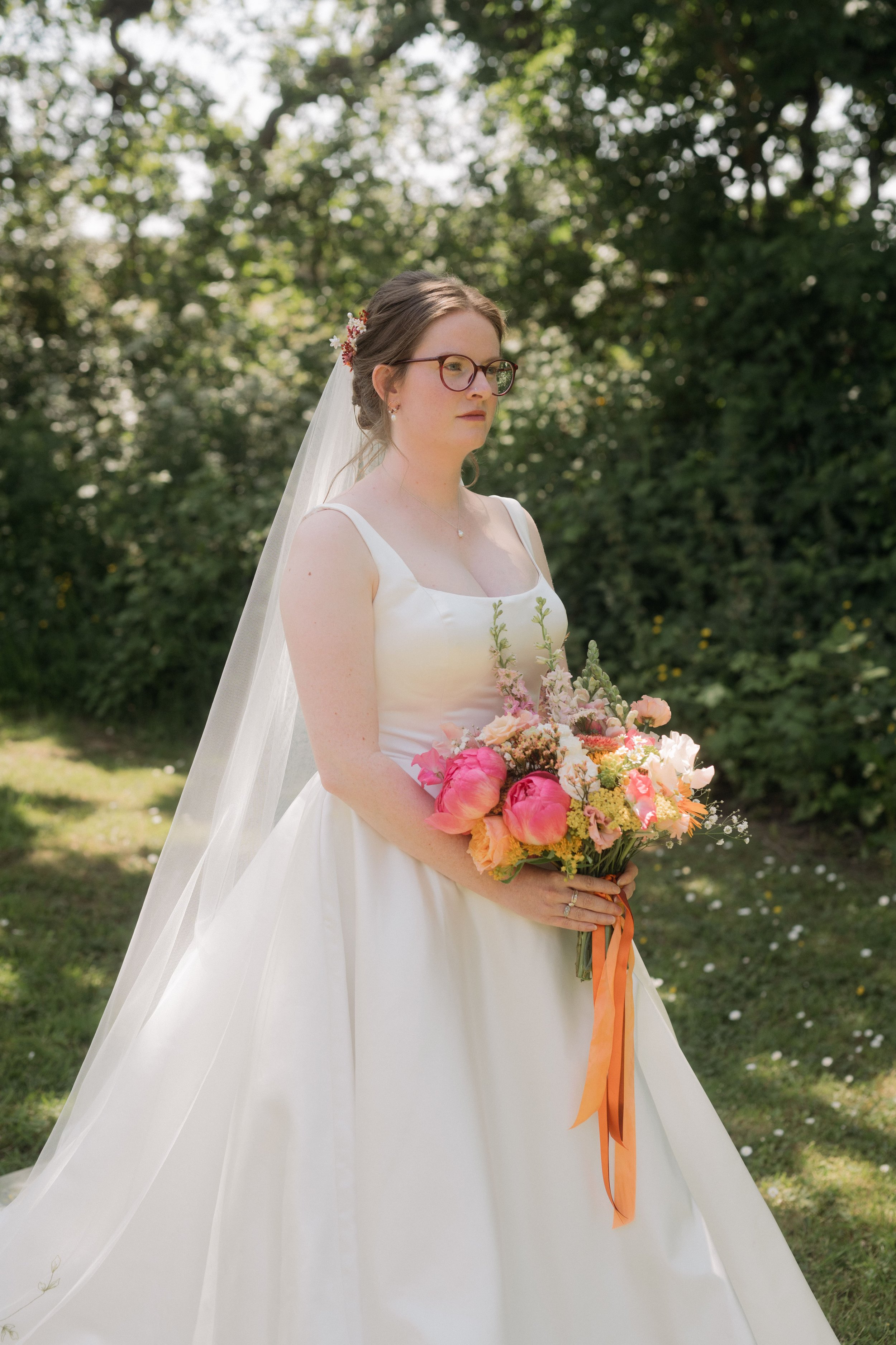  Bride posing with bouquet and veil 