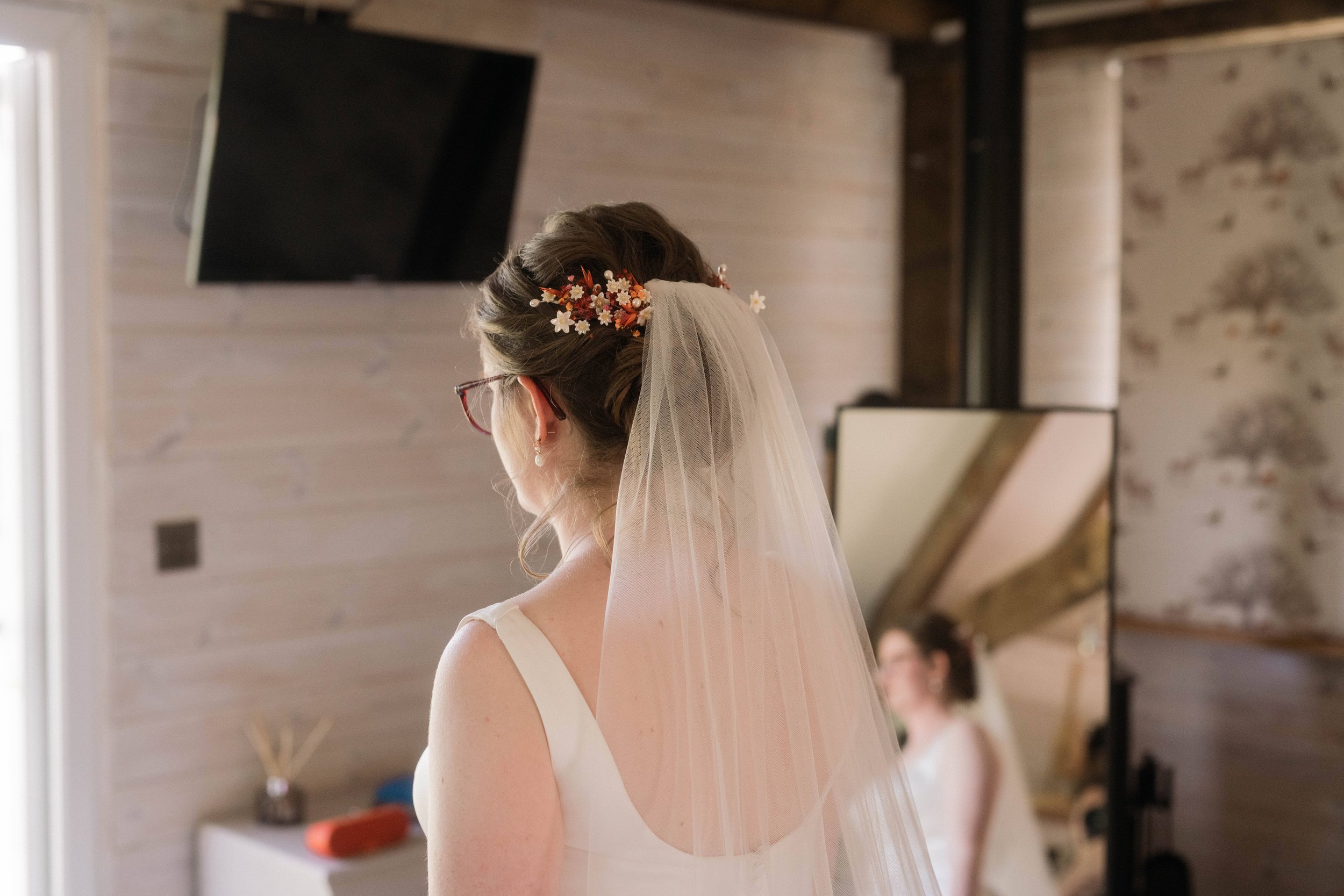  Bride getting ready with veil in her hair 