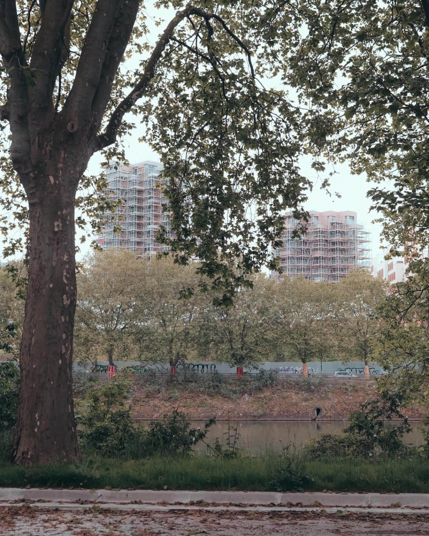 A glimpse of the Village De Athletes 2024 Olympic housing in the historic neighborhood of Saint-Denis overlooking the Seine. 

With many architects such as Dominique Perrault Architecture paving the way for connections of sport and housing beyond its