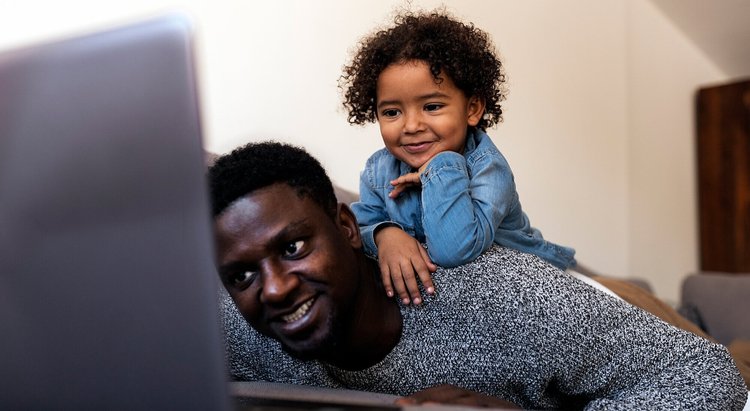 Smiling father with his young child