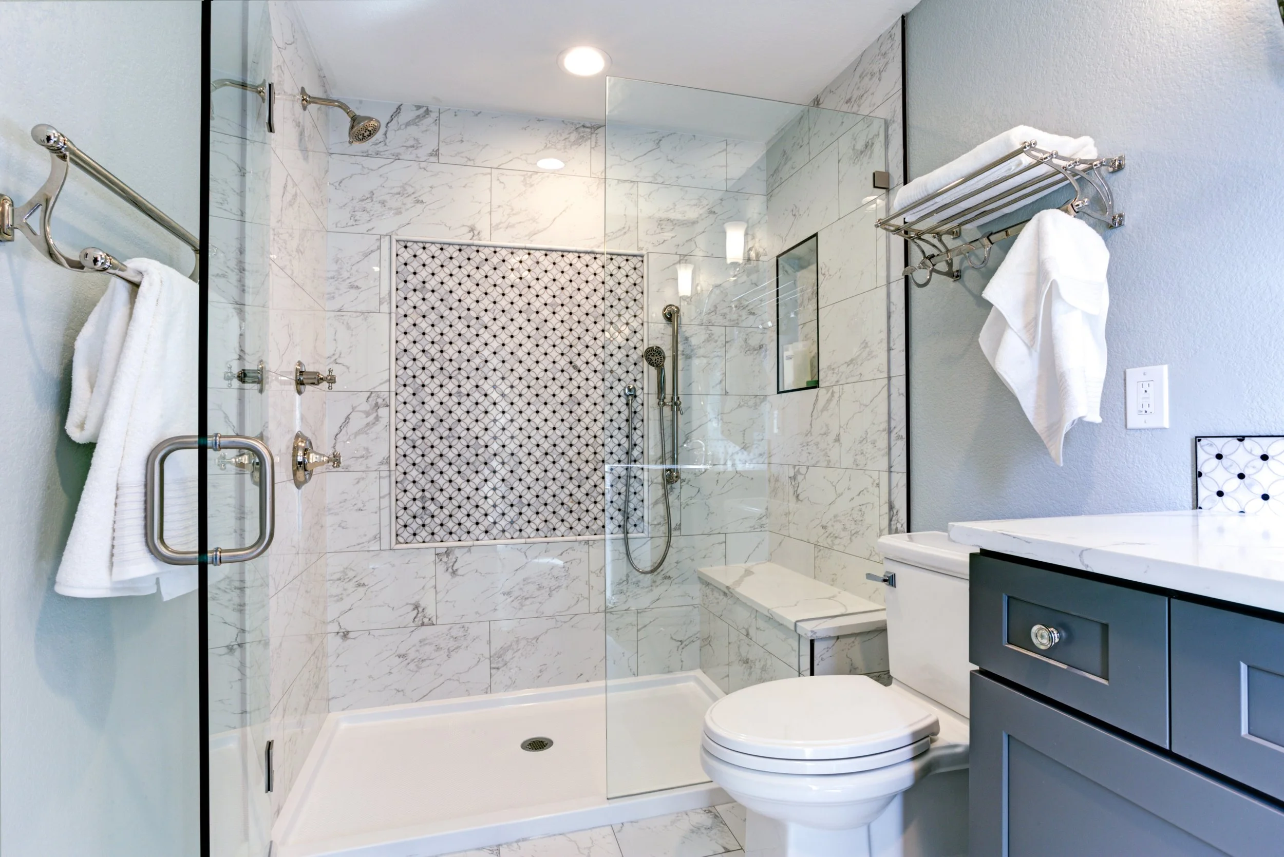 White marble tile, bathroom shower, tile shower, shower pan, shower bench, frameless shower door, Denver, Littleton, Aurora, Centennial, Parker, Colorado  