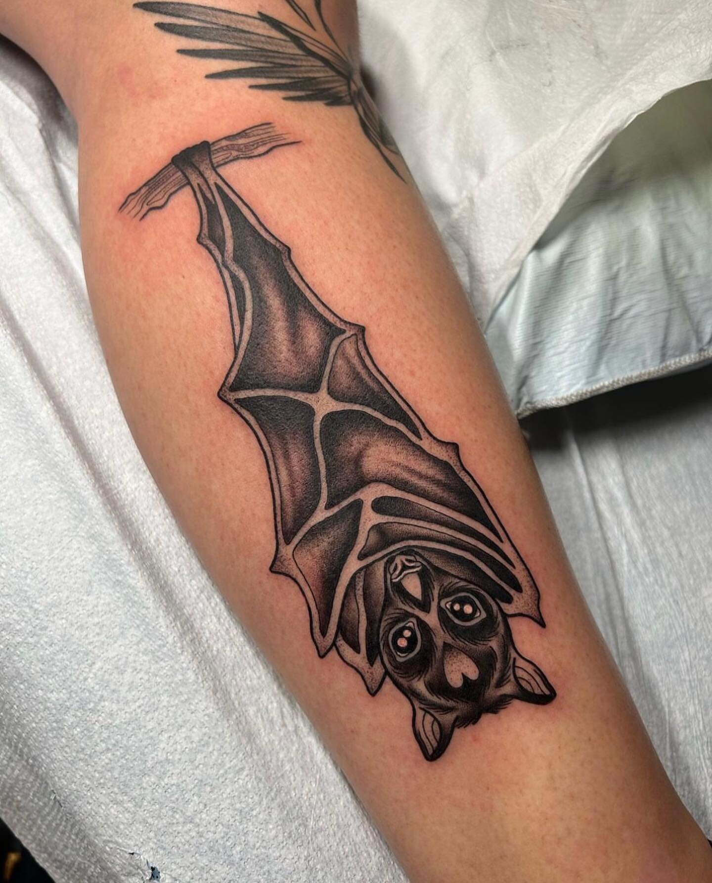 bat hanging upside down tattoo