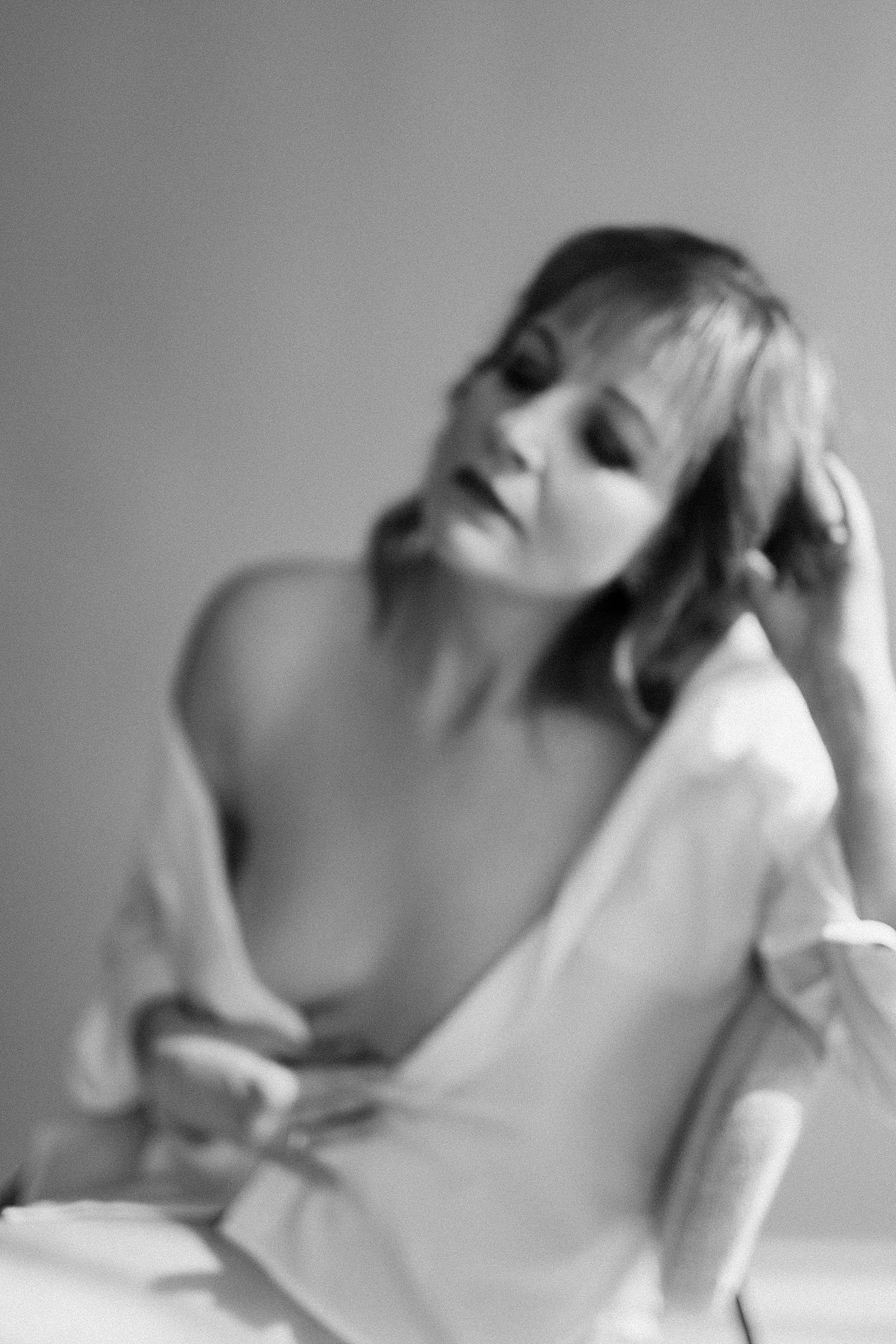 boudoir woman on chair blurry and beautiful