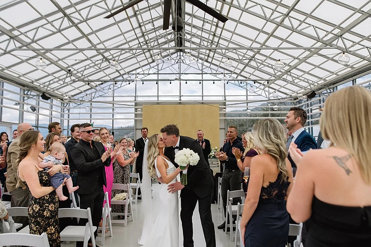 First kiss for bridge and groom at Monte Creek Winery Wedding Venue