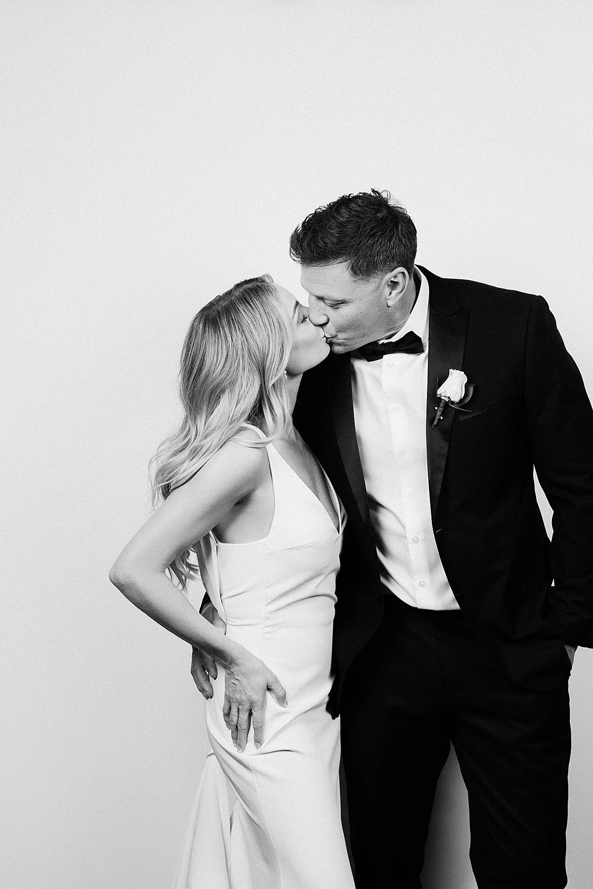 bride and groom looking stylish at modern Photo Booth at Delta Kamloops Wedding venue
