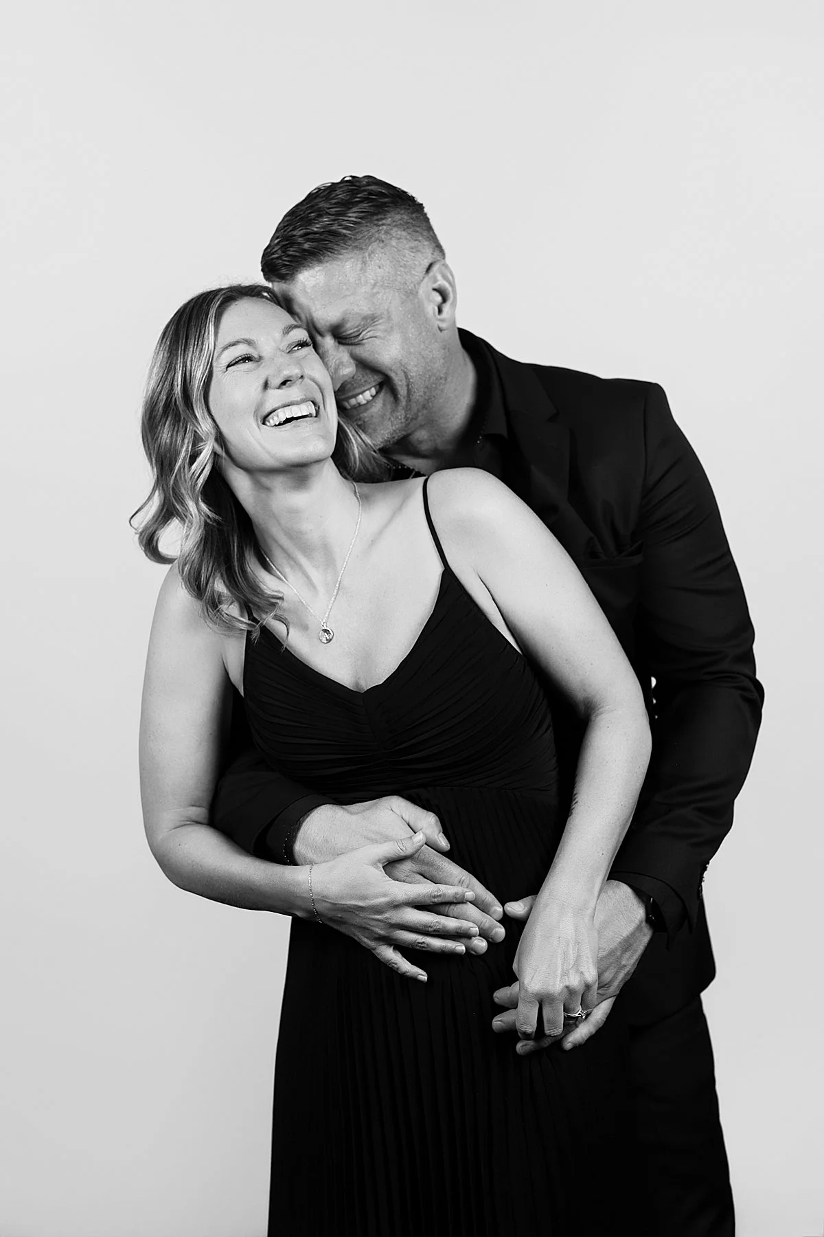 Wedding guest couple posing in a modern black-tie photo booth at a Kamloops wedding reception