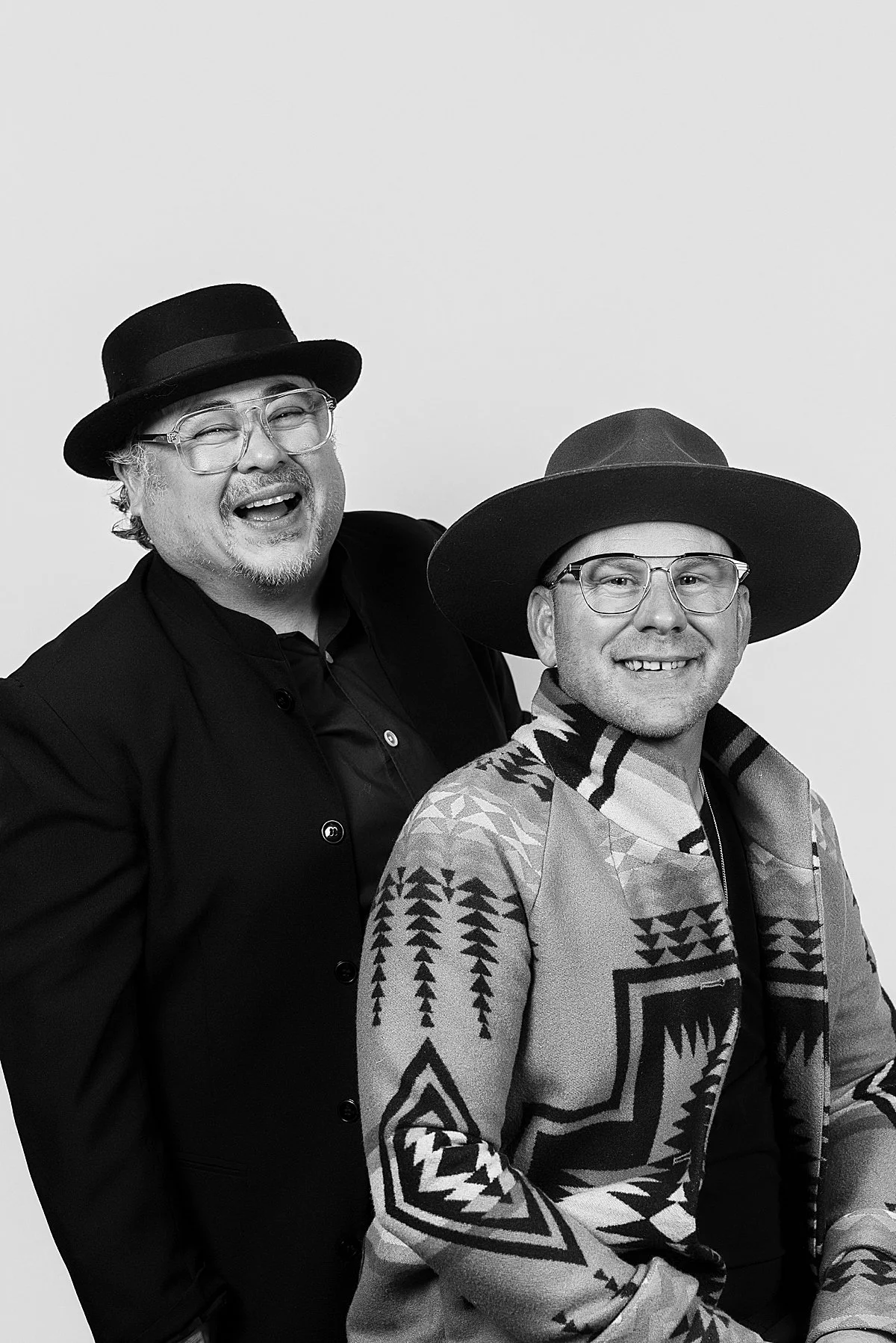 Ra Hair couple posing in a modern black-tie photo booth at a Kamloops wedding reception