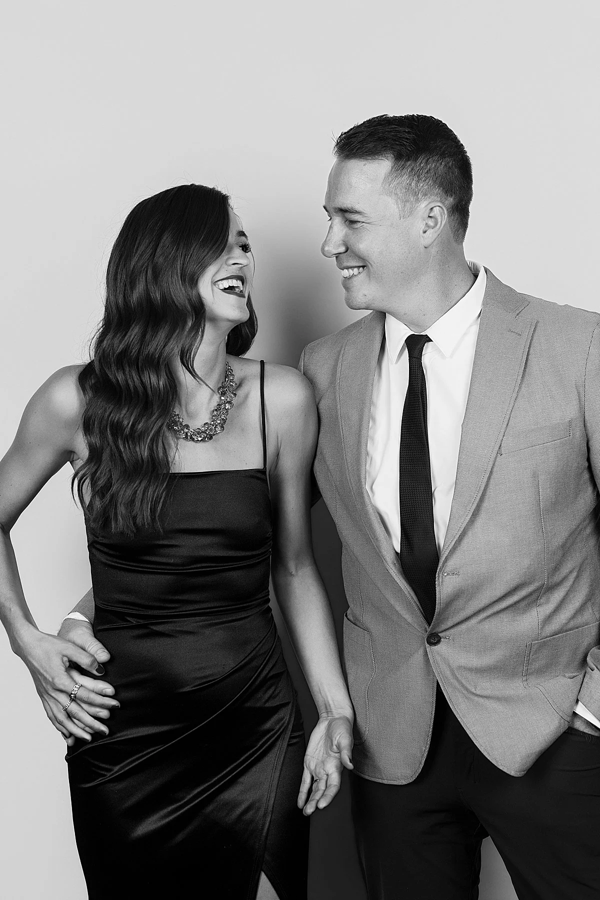 Wedding guest couple posing in a modern black-tie photo booth at a Kamloops wedding reception