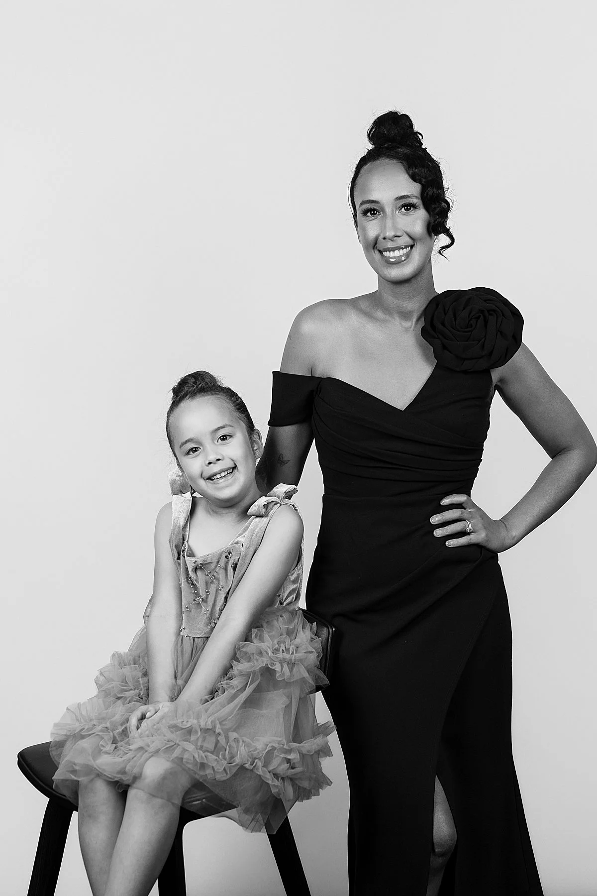 Mom + daughter posing in portrait studio session at reception