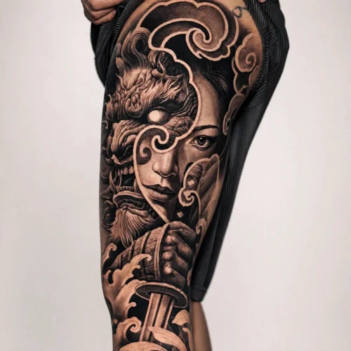 Large black-and-grey Japanese realism inner-arm dragon tattoo