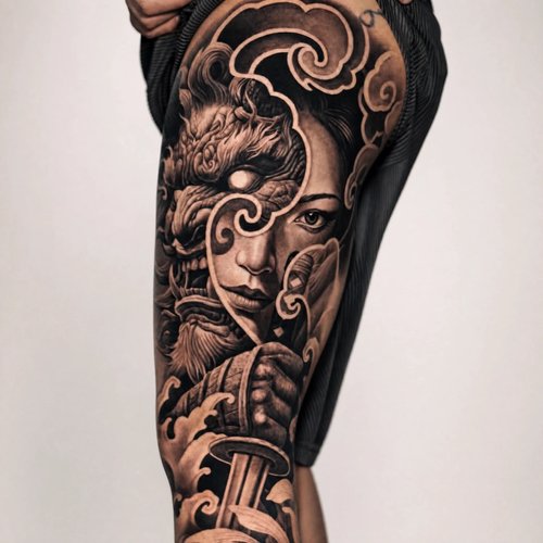 Large black-and-grey Japanese realism dragon and warrior chapter on the hip and thigh, Zen Tattoo Studio, Oakville.