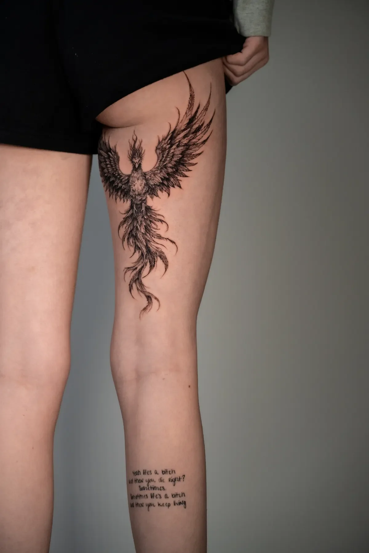 Large-scale fine line phoenix tattoo on the thigh, Zen Tattoo Studio Oakville.
