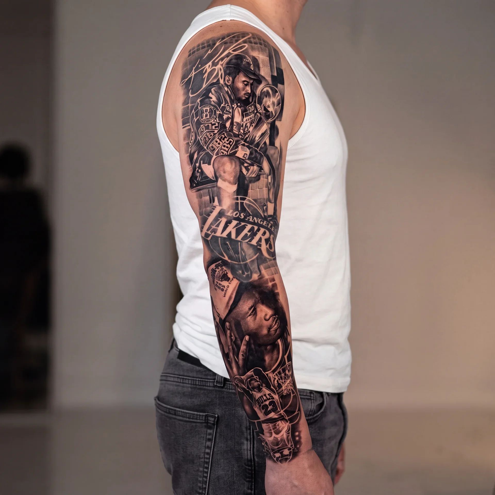 Athlete portrait sleeve tattoo ideas for men in black and grey realism