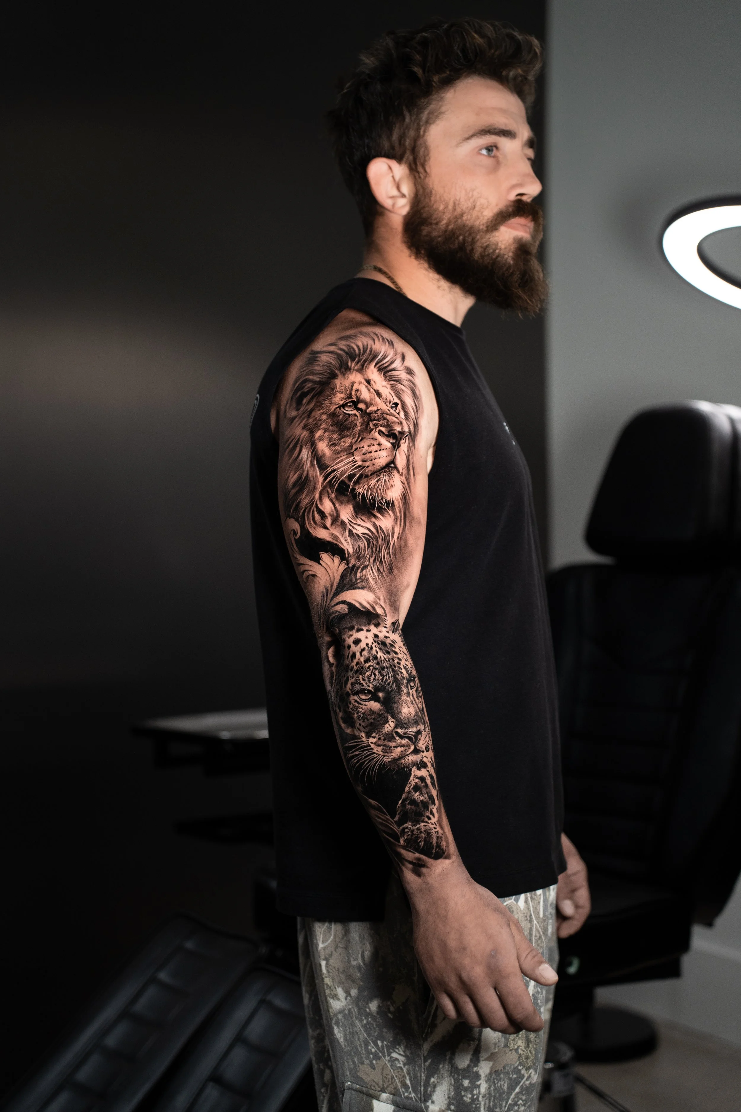 Black and grey realism full sleeve tattoo by Luis Fernandez at Zen Tattoo Studio, Oakville. Large scale sleeve featuring wildlife and mythology — photographed in studio, serving Toronto and the GTA.