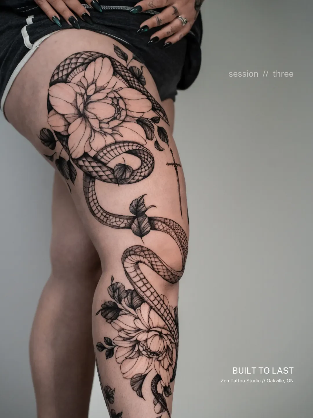 Full-leg fine line tattoo in progress at Zen Tattoo Studio in Oakville, floral and snake composition, session three.