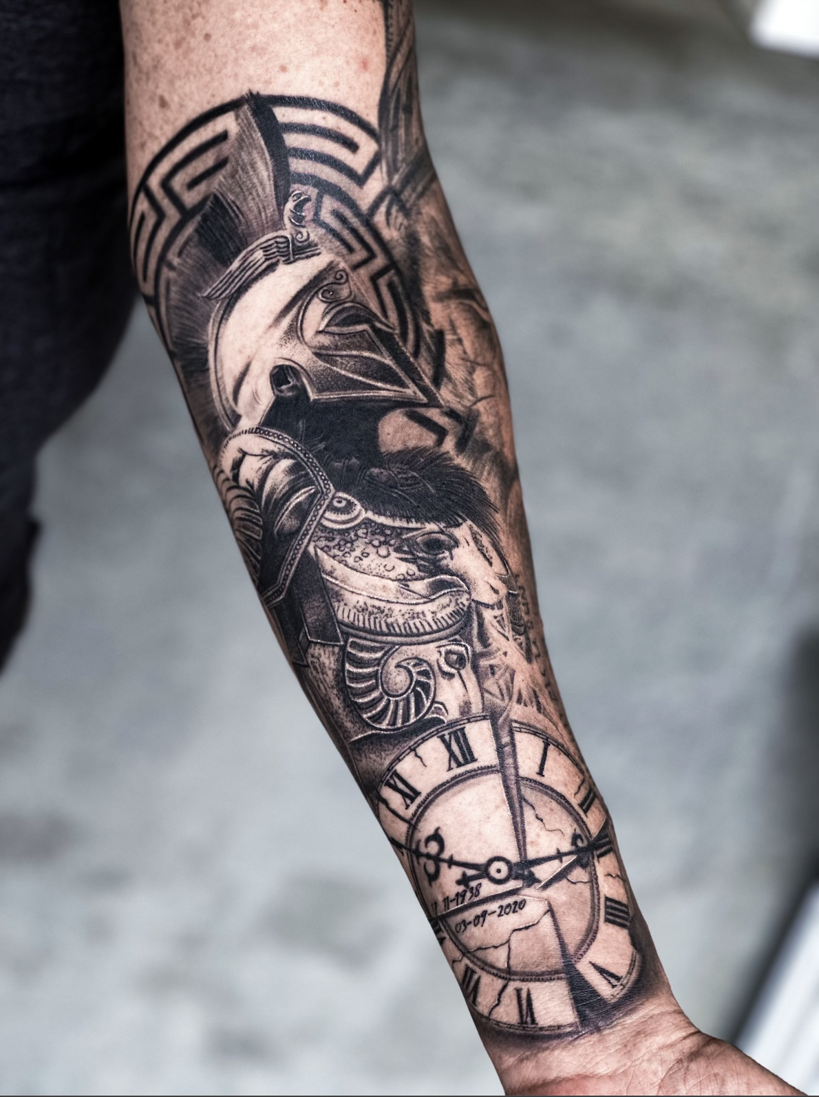 tattoo of Greek warrior and clock on forearm