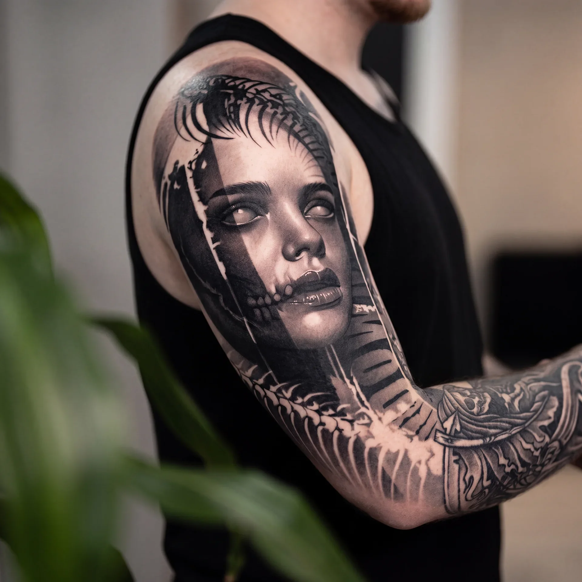 Dark realism sleeve tattoo for men with skull smoke and cinematic black and grey shading