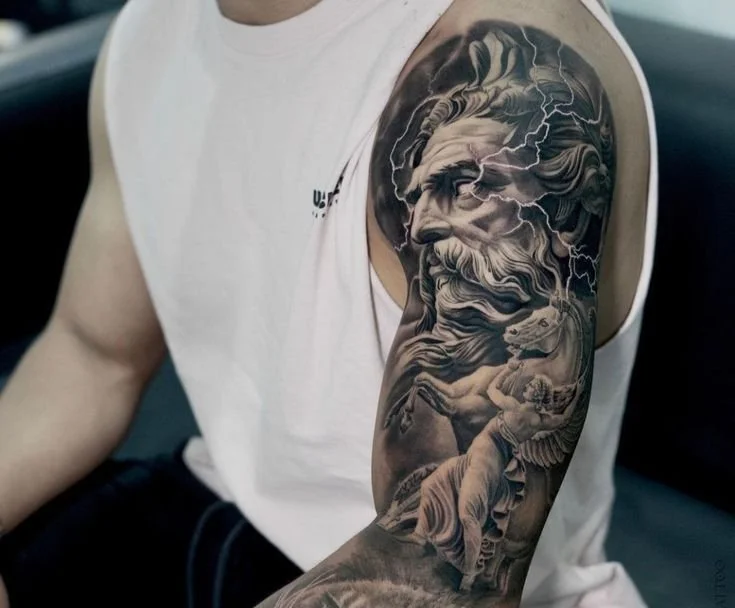 reek mythology gods tattoos featuring Zeus in black and grey realism with dramatic lighting