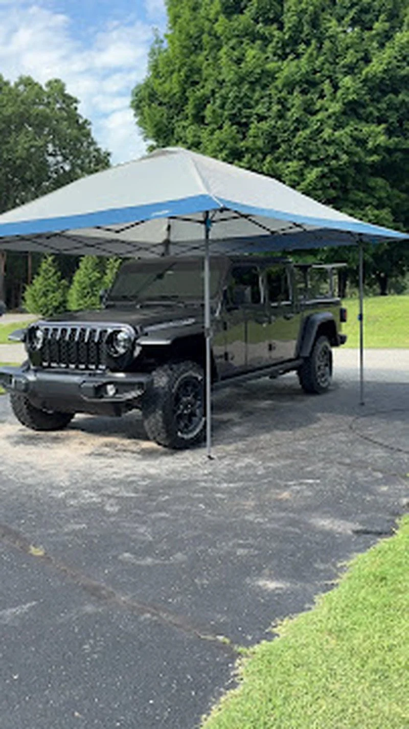 LCB Auto Detailing tent setup with a detailed black Jeep