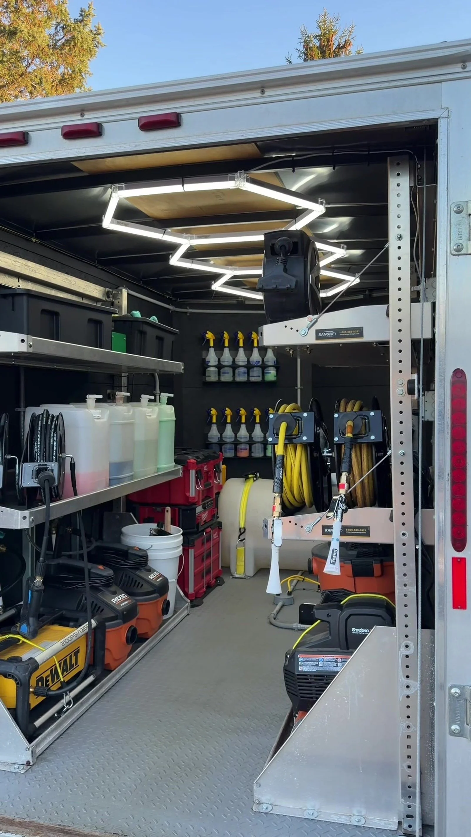 Inside the LCB Auto Detailing mobile trailer with products and equipment