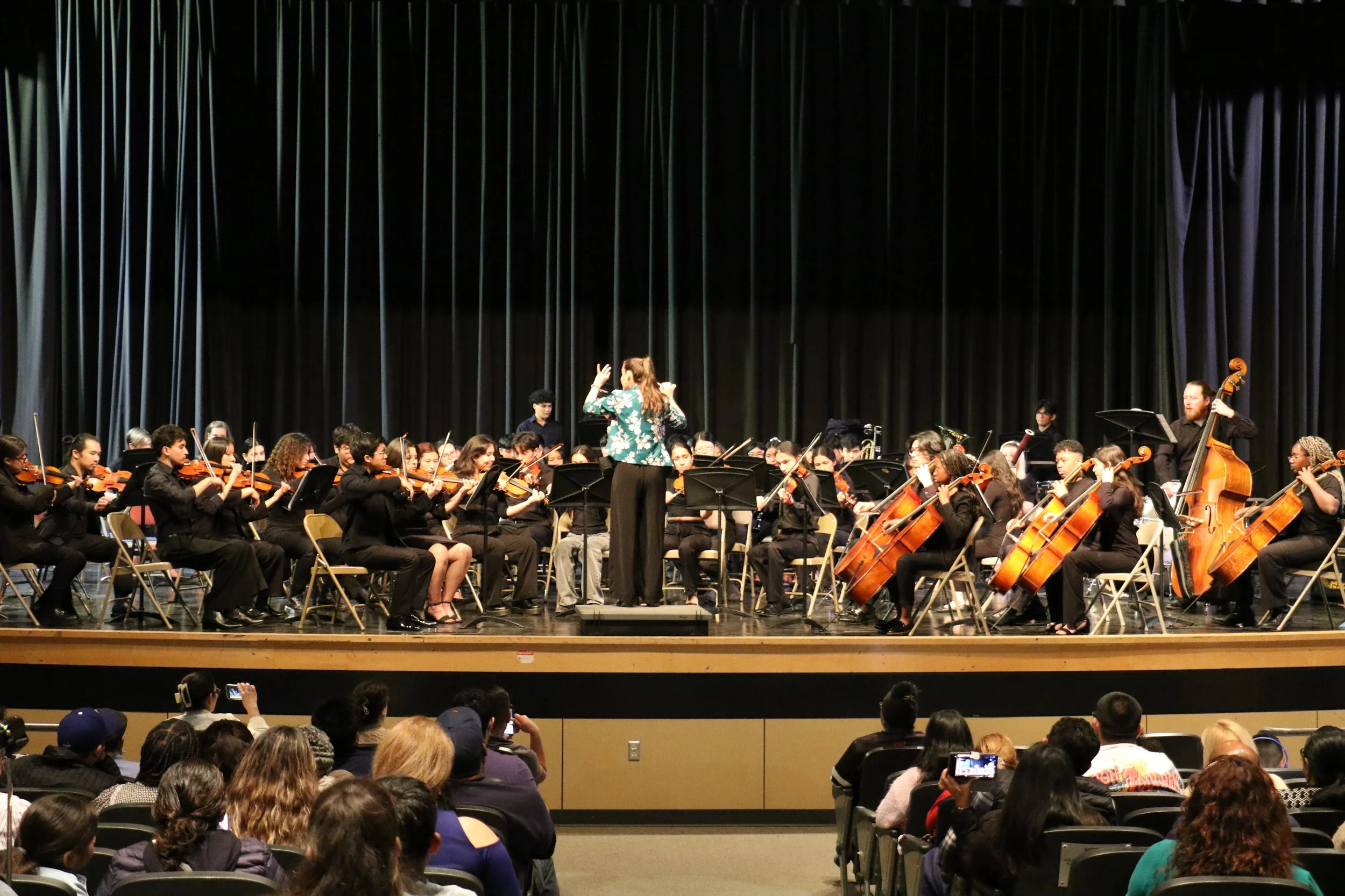 Harmony Project orchestra performing at a concert.