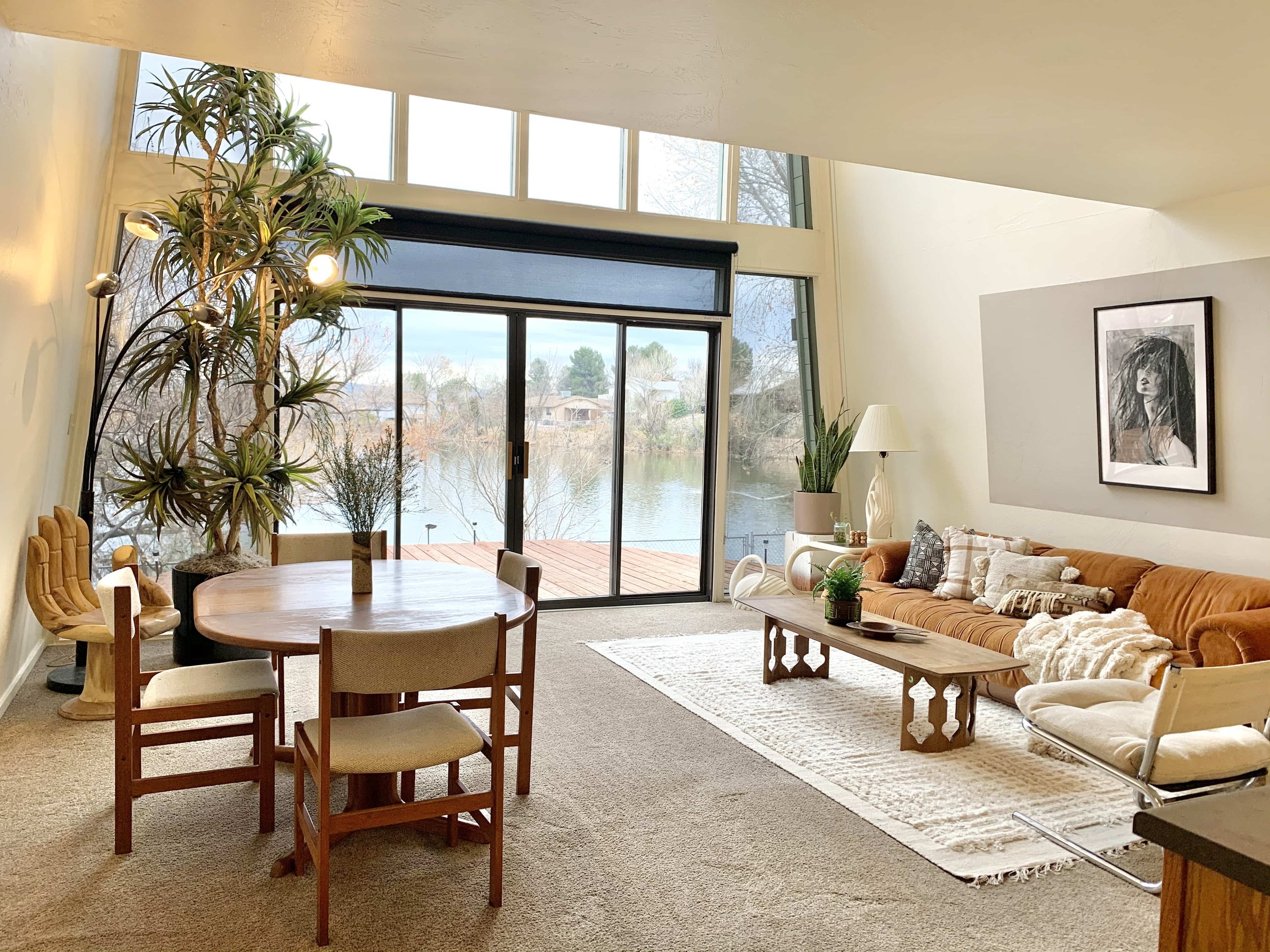The inside of the duck pond reveals large windows and a beautifully curated living space
