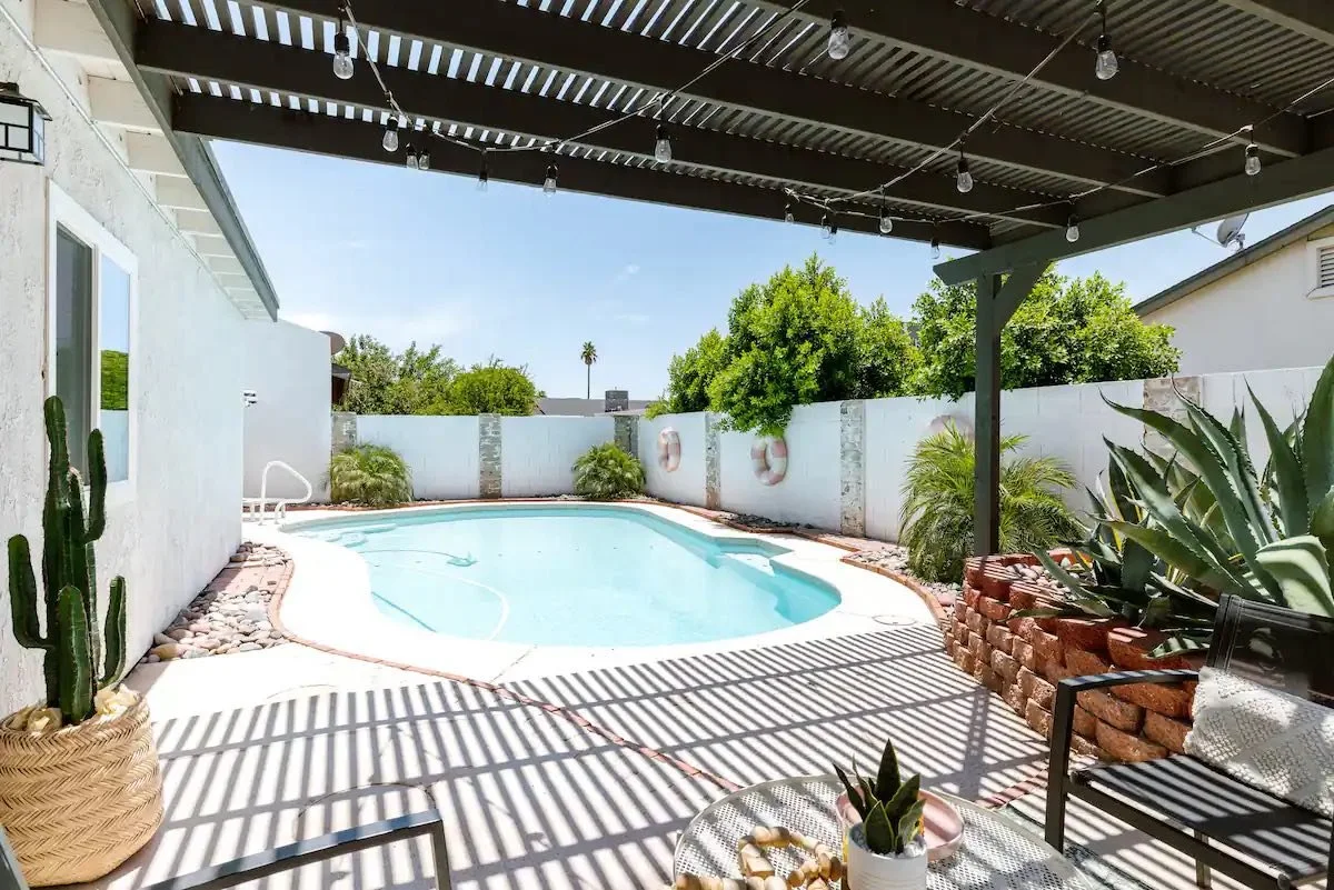View of the haeated pool from the pergola at The Duke in Old Town Scottsdale