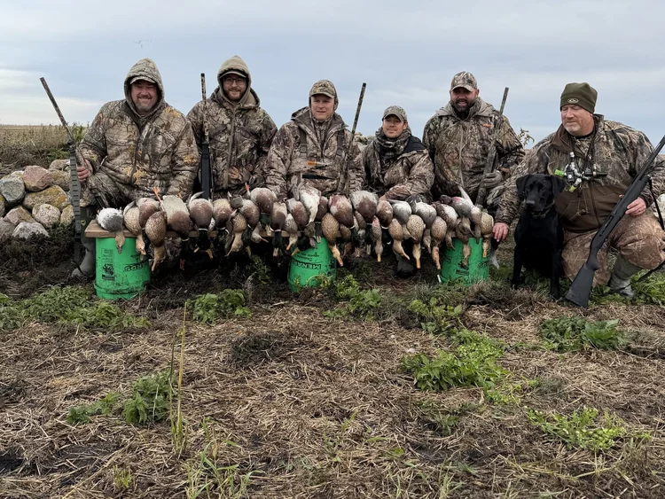 Clients with their regular season birds after a guided Whisky Creek hunt