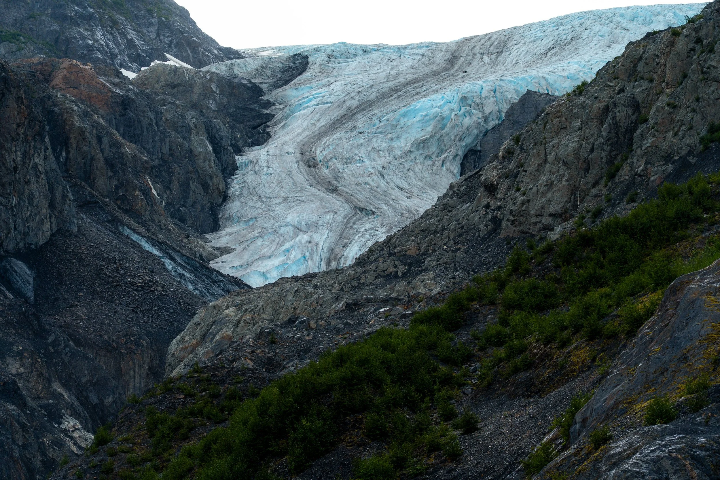 The Exit glacier is located in the Kenai Fjords National Park, Alaska. It can be easily seen, at a distance, from an easily walkable park trail. It clearly shows glacial recession (ice loss) due to climate change with many historical markers indicat