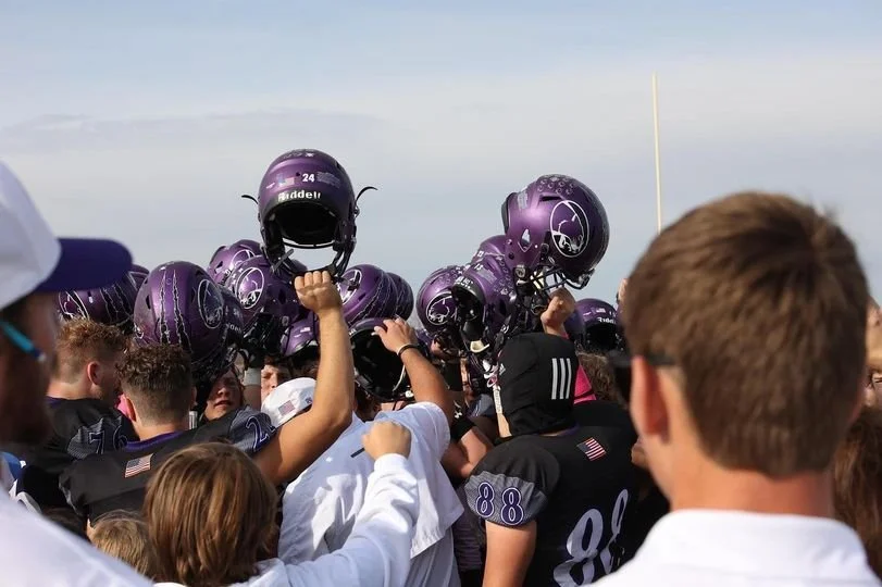 Cougar football helmet raise.jpg