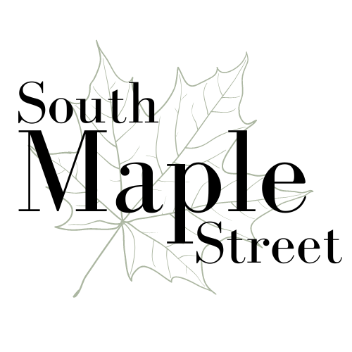 A drawing of a maple leaf outlined on a black background.