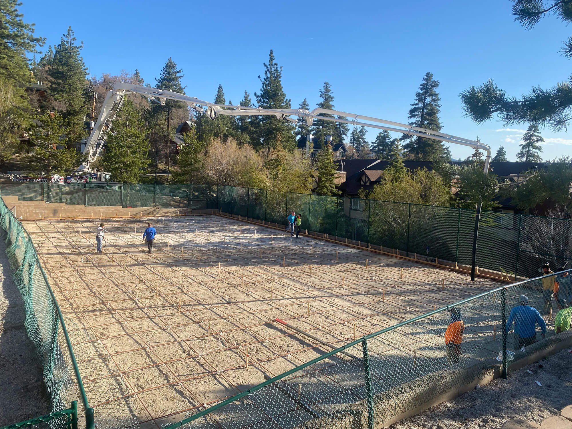  In progress installation of a combination court being built by the Palm Springs Tennis Courts team in a mountain area. 