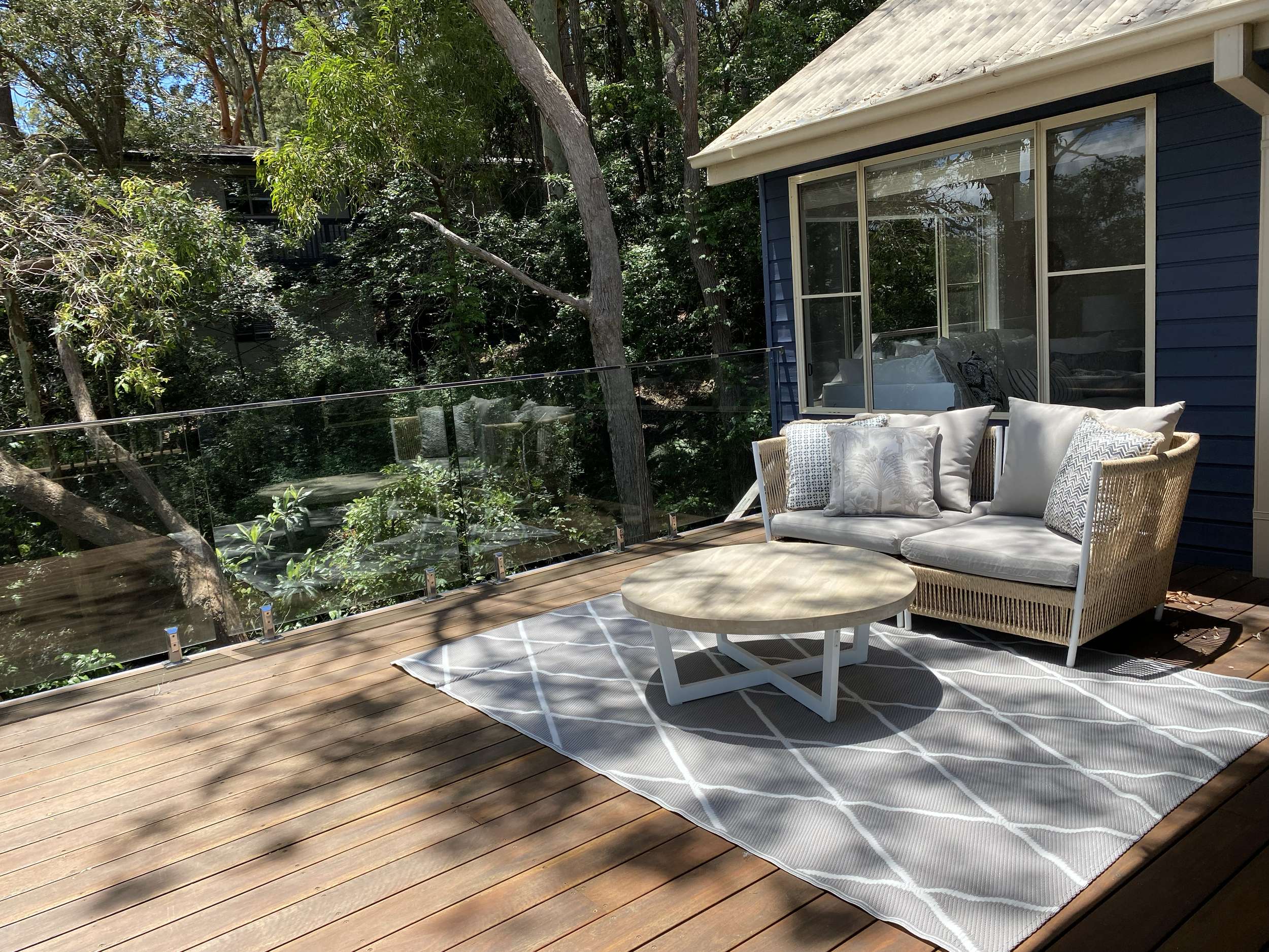 Furniture, cushions and rug create the perfect outdoor lounge setting