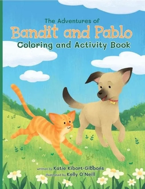 Cover of 'The Adventures of Bandit and Pablo: Coloring and Activity Book' showing a cartoon dog and cat in a grassy field with clouds in the sky.