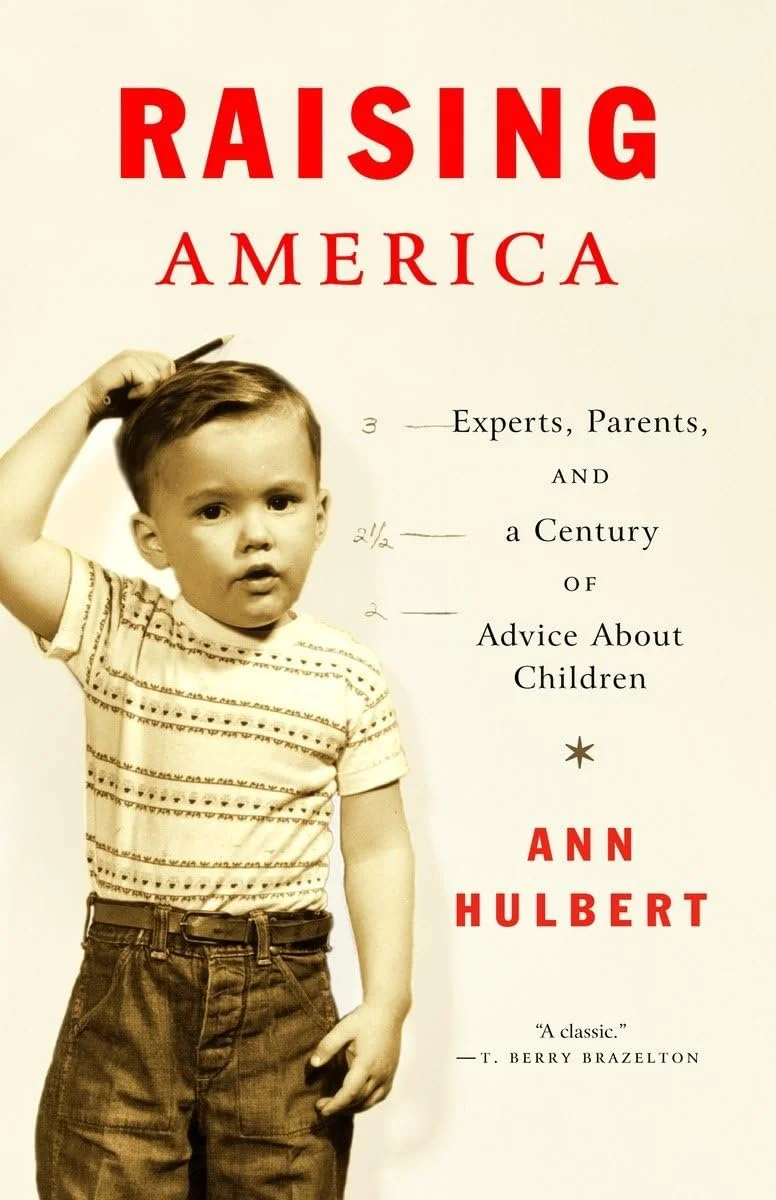 Book cover of 'Raising America: Experts, Parents, and a Century of Advice About Children' by Ann Hulbert, featuring a sepia-toned image of a young boy holding a comb.