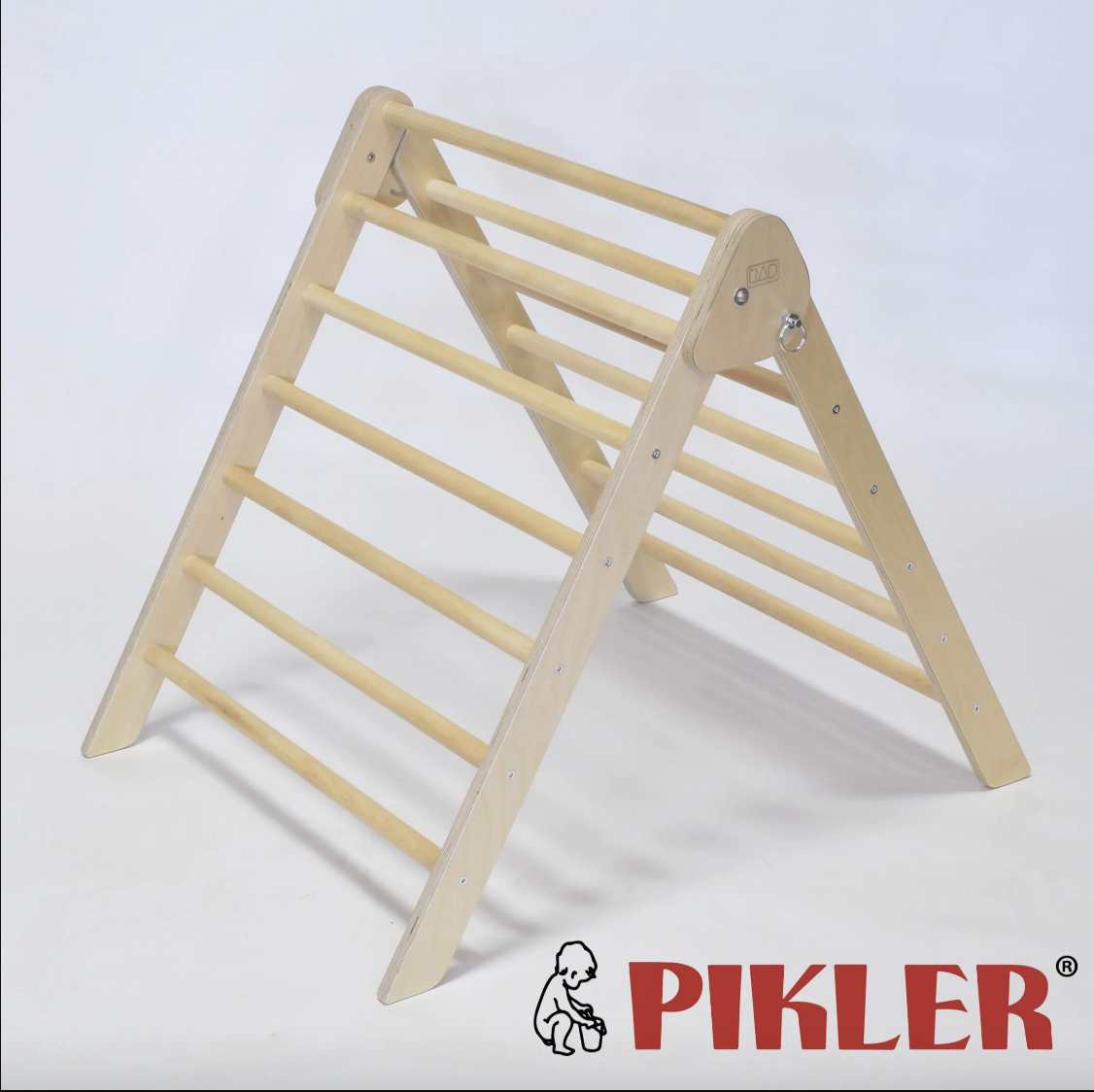 Wooden Pikler triangle for children with horizontal bars, placed on a neutral background, manufactured by RAD Children's furniture.
