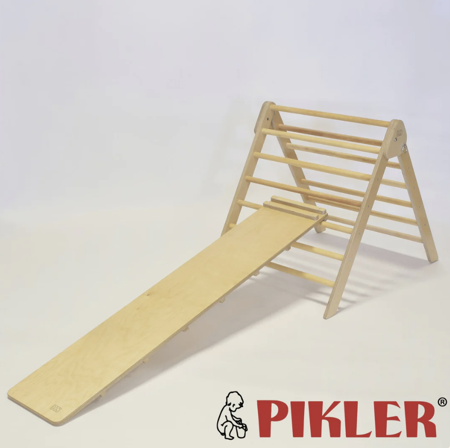 Wooden Pikler triangle climbing frame with slide attachment, manufactured by RAD children's furniture.