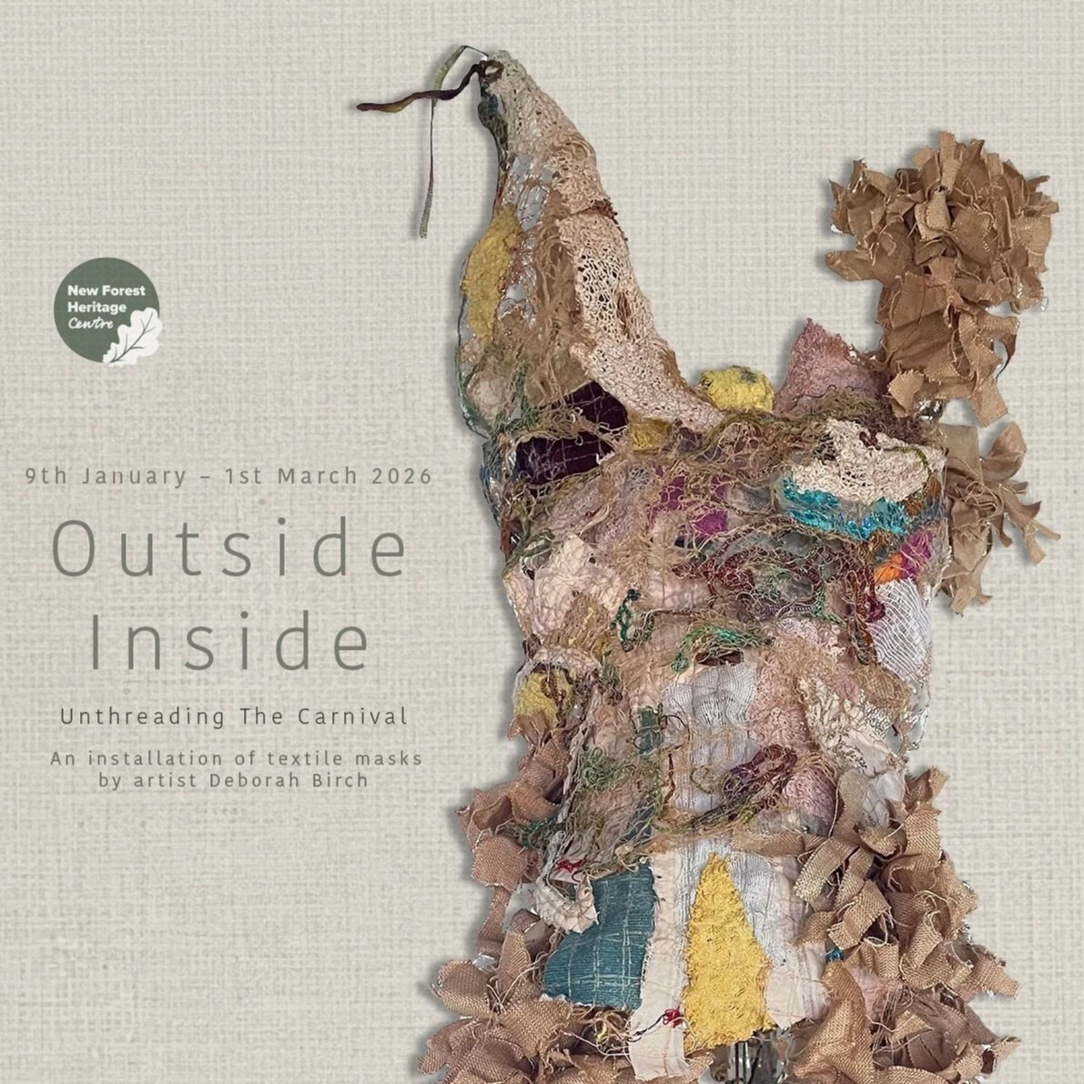 A mixed media textile art piece resembling a figure or creature made from torn and layered fabrics, displayed on a wall next to text about an art exhibition.