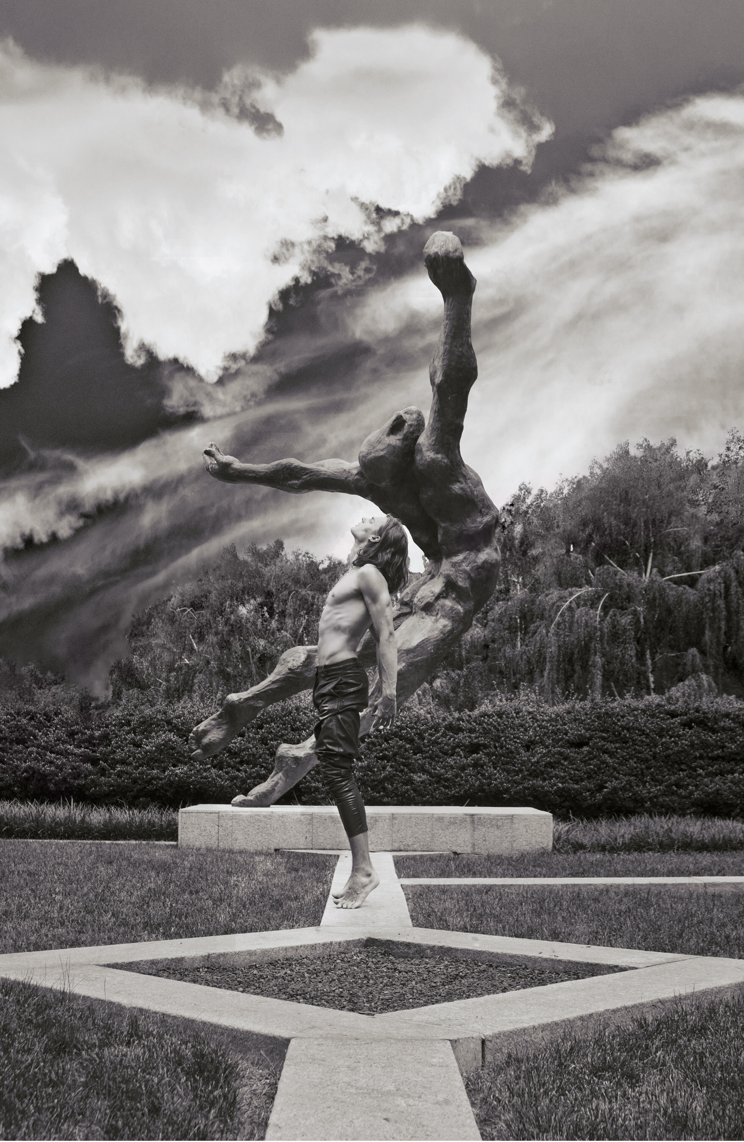 fine art print of man standing near a statue outside