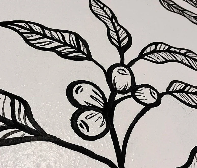 Black and white line drawing of a plant with leaves and berries on a white background.