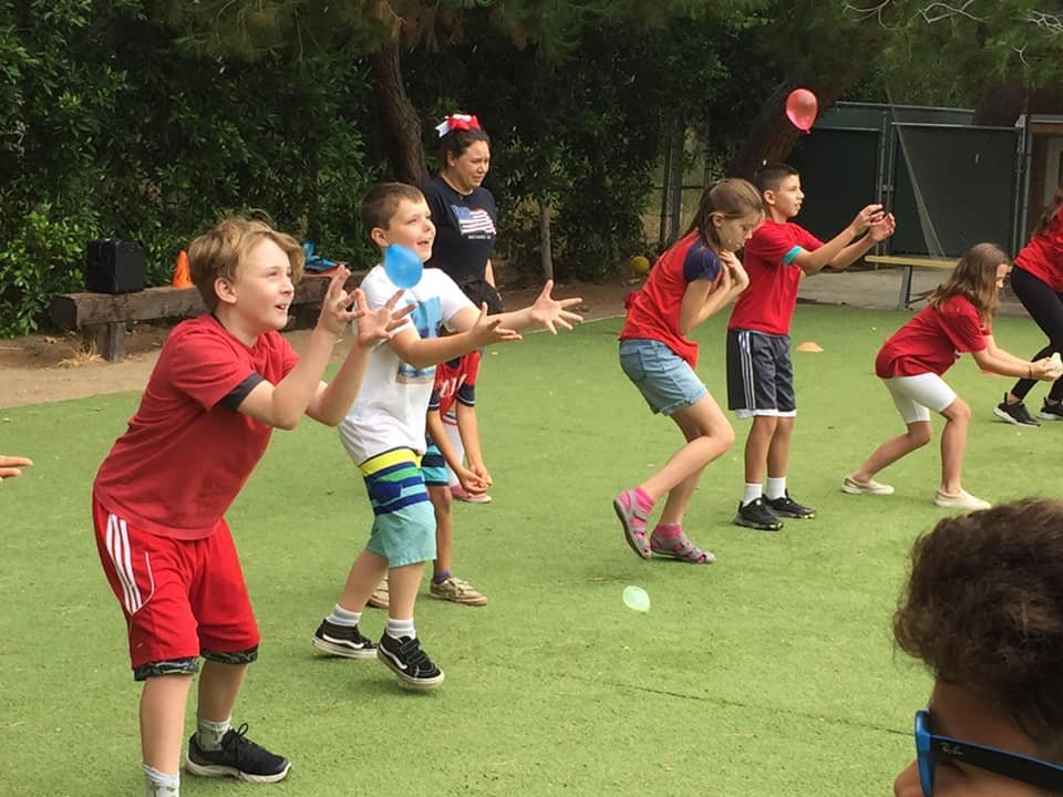 Children enjoying summer activities at Camp Woodland Hills