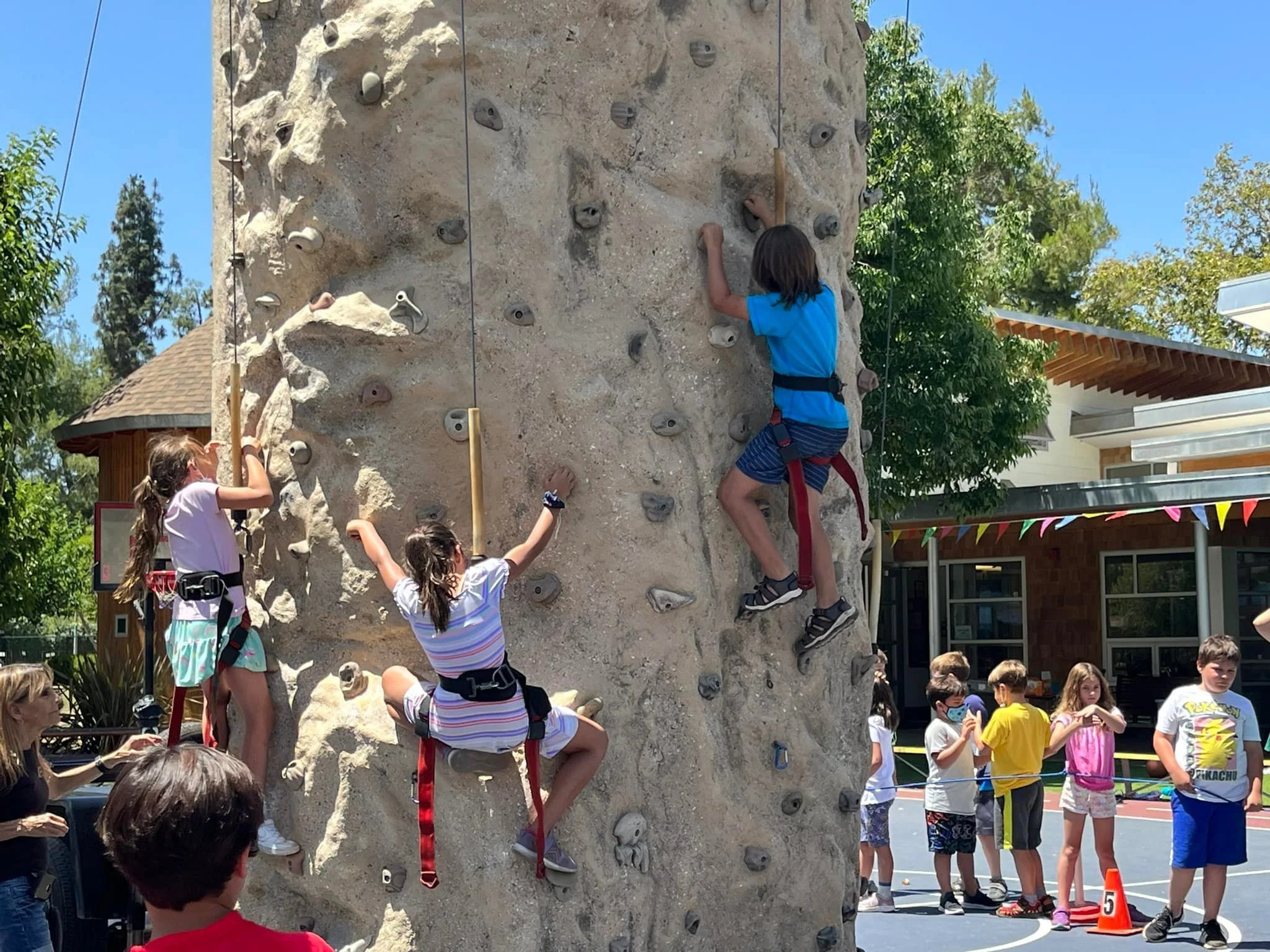 Elementary campers enjoying the rock-climbing wall