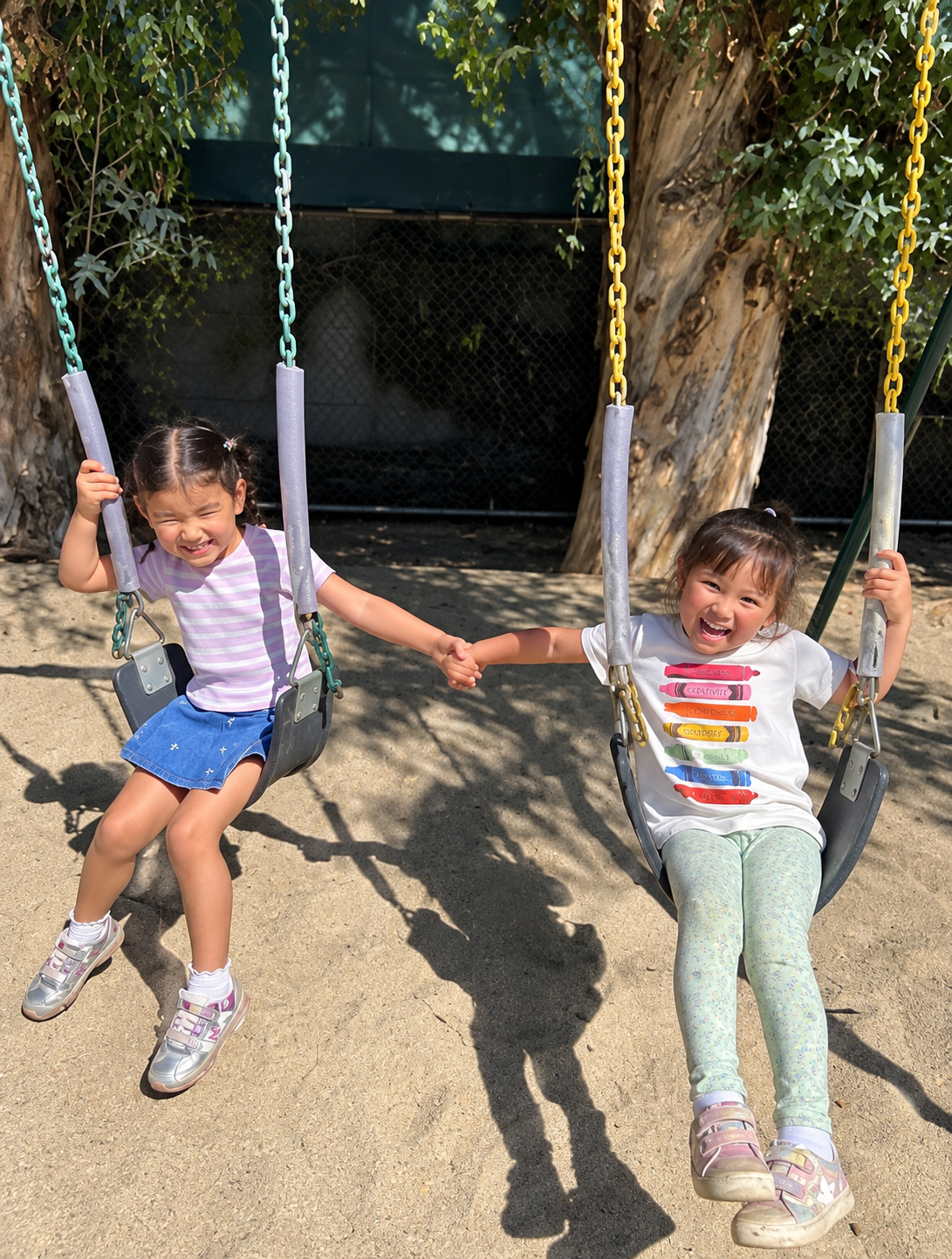 WHPS preschool children playing together on the swings