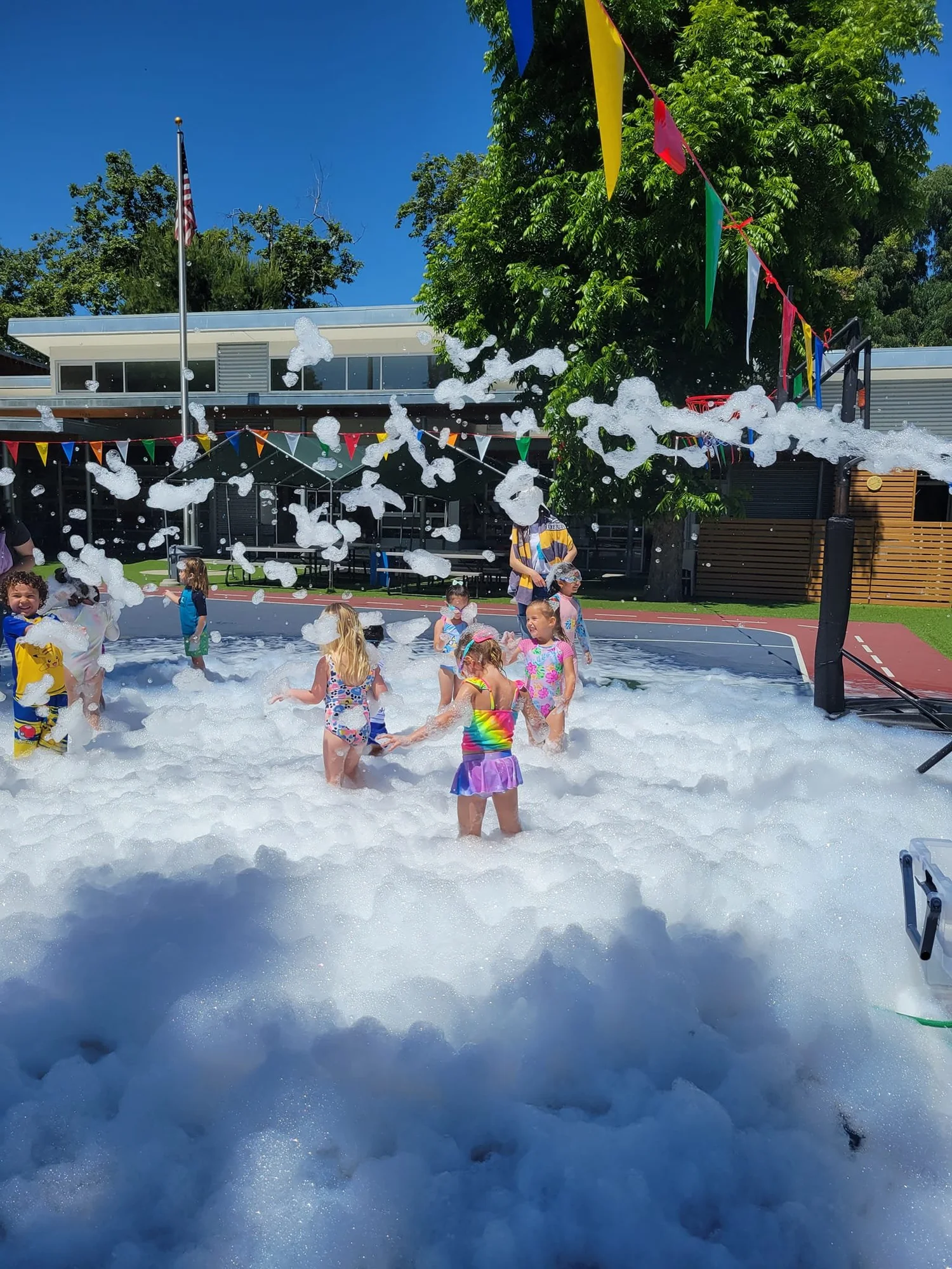 Preschool children enjoying a summer foam party